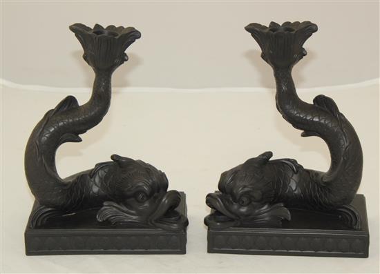 A pair of Wedgwood black basalt dolphin candlesticks, 21.5cm